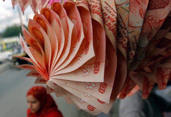 FOREX UPDATE: Rupee closes 13 paise higher at 63.39