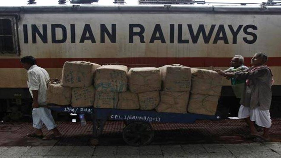Porters transport goods on a hand-pulled trolley to load onto a train at a railway station in Kolkata (Photo: Reuters) Porters transport goods on a hand-pulled trolley to load onto a train at a railway station in Kolkata (Photo: Reuters)