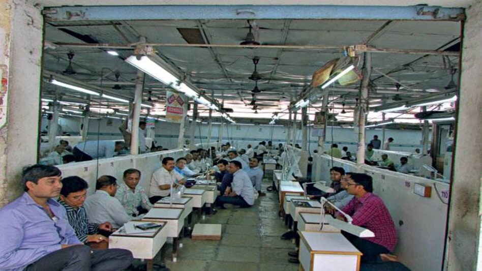 Diamond traders and brokers sit idle at the diamond trading hub of Mini Bazaar, Surat, awaiting a revival (Photo: Sarika Malhotra) Diamond traders and brokers sit idle at the diamond trading hub of Mini Bazaar, Surat, awaiting a revival (Photo: Sarika Malhotra)