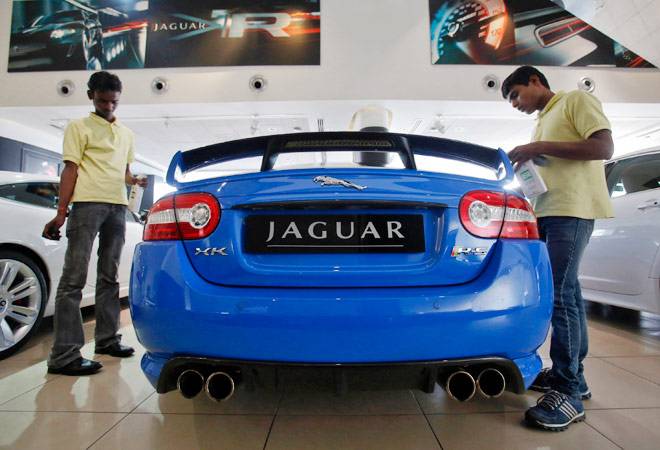 Jaguar Land Rover sees 2015 profit down on China blast, investments