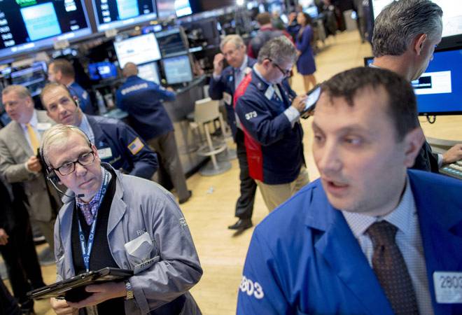 Wall Street ends flat; Disney, retailers dip on sales worries