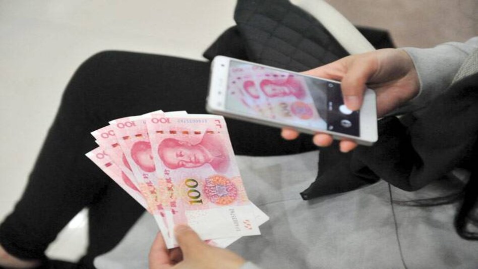 China's central bank has devalued its currency by 0.51 per cent to 6.56 per cent against the dollar, the lowest since March 2011. (Photo: Reuters) China's central bank has devalued its currency by 0.51 per cent to 6.56 per cent against the dollar, the lowest since March 2011. (Photo: Reuters)