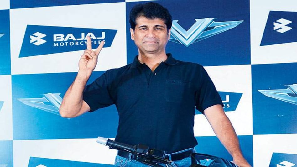 Bajaj Auto MD Rajiv Bajaj launches 'V', which contains metal from carrier INS Vikrant, in New Delhi on Monday. Bajaj Auto MD Rajiv Bajaj launches 'V', which contains metal from carrier INS Vikrant, in New Delhi on Monday.