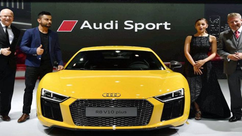 Audi India Head Joe King (R) and Terence Bryce Johnsson, Vice President of Overseas Sales at Audi with Test captain Virat Kohli and actress Alia Bhatt at the launch of Audi's new sports car R8 V10 plus at Auto Expo 2016 in Greater Noida. Audi India Head Joe King (R) and Terence Bryce Johnsson, Vice President of Overseas Sales at Audi with Test captain Virat Kohli and actress Alia Bhatt at the launch of Audi's new sports car R8 V10 plus at Auto Expo 2016 in Greater Noida.