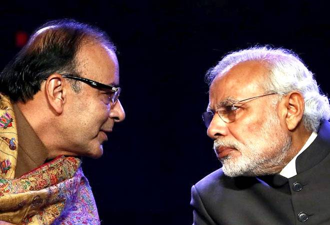Prime Minister Narendra Modi (R) listens to Finance Minister Arun Jaitley Prime Minister Narendra Modi (R) listens to Finance Minister Arun Jaitley