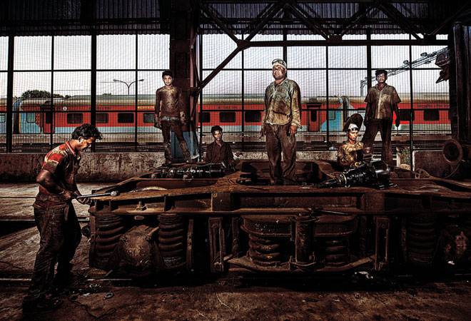 Railway employees working at Delhi's locomotive shed (Photograph By Vivan Mehra) Railway employees working at Delhi's locomotive shed (Photograph By Vivan Mehra)