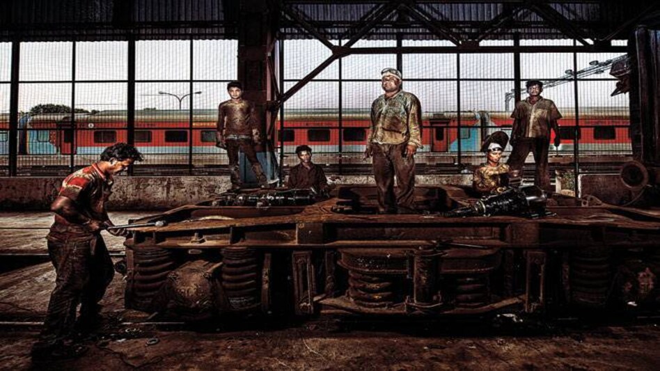 Railway employees working at Delhi's locomotive shed (Photograph By Vivan Mehra) Railway employees working at Delhi's locomotive shed (Photograph By Vivan Mehra)