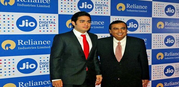 Mukesh Ambani (R), chairman of Reliance Industries Ltd, poses with his son Akash before addressing the company's annual general meeting in Mumbai. (Photo: Reuters) Mukesh Ambani (R), chairman of Reliance Industries Ltd, poses with his son Akash before addressing the company's annual general meeting in Mumbai. (Photo: Reuters)