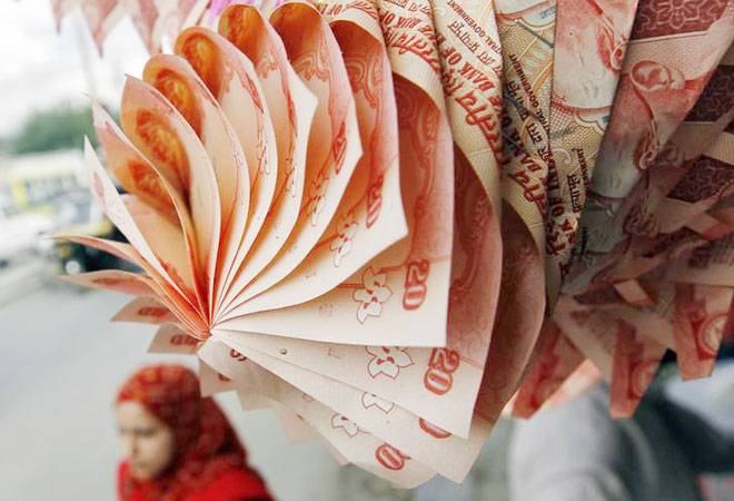 Rupee climbs to 2 week high against dollar; up 11 paise