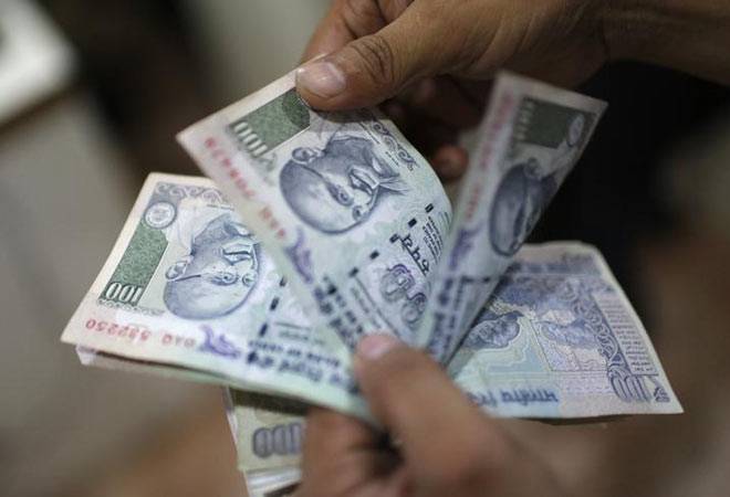 Rupee hits 2-week low at 67.02 vs dollar on devaluation reports
