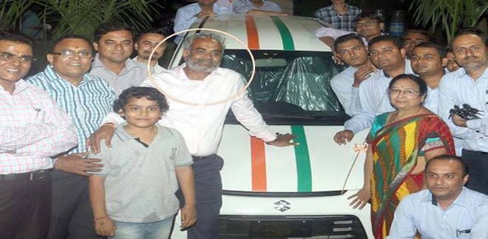Surat-based businessman Savji Dholakia with his employees. Surat-based businessman Savji Dholakia with his employees.