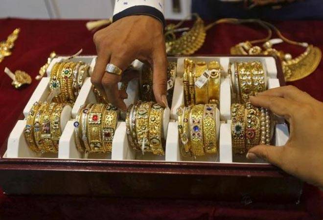 Gold prices stay firm on strong festive demand in India