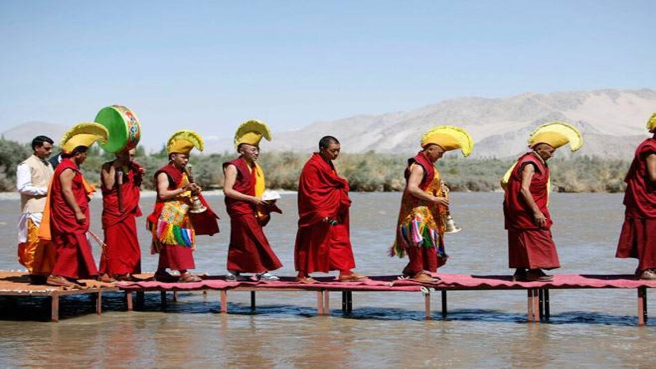A file image of Monks walk on a platform floating on the Indus river to perform rituals during the "Sindhu Darshan" festival in Leh, capital of Ladakh. (Reuters) A file image of Monks walk on a platform floating on the Indus river to perform rituals during the "Sindhu Darshan" festival in Leh, capital of Ladakh. (Reuters)