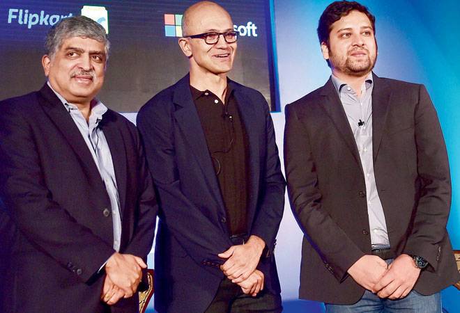 Microsoft CEO Satya Nadella with EkStep Co Founder and Chairman Nandan Nilekani and Flipkart co-founder and CEO Binny Bansal (R) during an event on startup stalwarts of India in Bengaluru on Monday. Microsoft CEO Satya Nadella with EkStep Co Founder and Chairman Nandan Nilekani and Flipkart co-founder and CEO Binny Bansal (R) during an event on startup stalwarts of India in Bengaluru on Monday.
