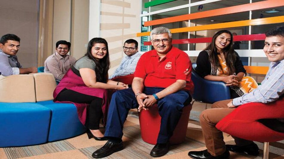 Ashwani Prashara (in red T-shirt) with his team at Reliance Corporate Park Ashwani Prashara (in red T-shirt) with his team at Reliance Corporate Park