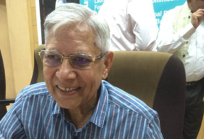 P C Parakh signing copies at the book launch.