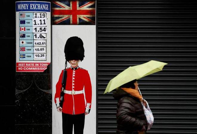 Sterling steadies as British PM scrambles after poll shock, dollar awaits Fed