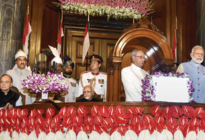 President Pranab Mukherjee and PM Narendra Modi ringing in the GST in Parliament President Pranab Mukherjee and PM Narendra Modi ringing in the GST in Parliament