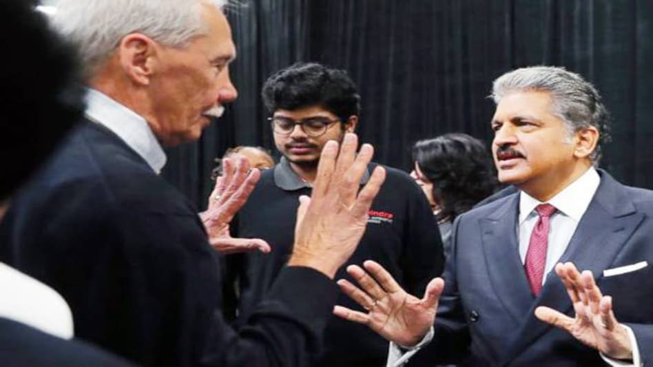 ahindra Group Chairman Anand G. Mahindra, center, speaks with employees in Auburn Hills (Photo: AP) ahindra Group Chairman Anand G. Mahindra, center, speaks with employees in Auburn Hills (Photo: AP)