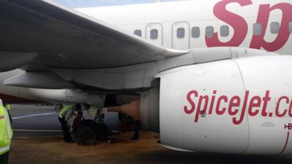 The SpiceJet plane that suffered a tyre burst at the Chennai Airport on Thursday. The SpiceJet plane that suffered a tyre burst at the Chennai Airport on Thursday.
