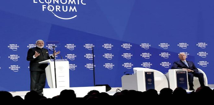 PM Narendra Modi addressing the gathering at Davos with WEF founder Klaus Schwab PM Narendra Modi addressing the gathering at Davos with WEF founder Klaus Schwab