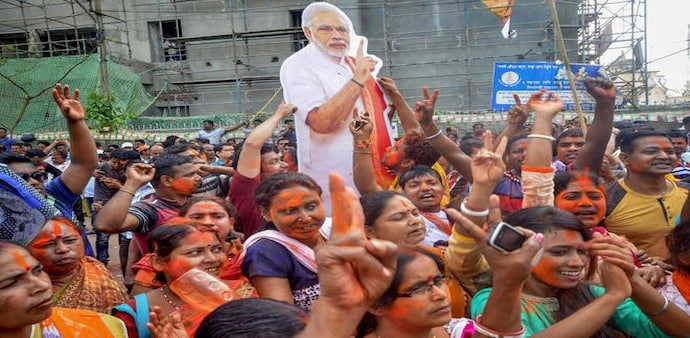 BJP supporters celebrate in Agartala. Image: PTI BJP supporters celebrate in Agartala. Image: PTI