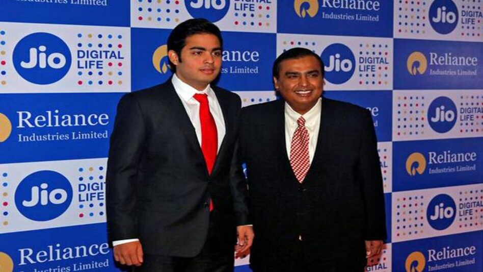 Mukesh Ambani (R), chairman of Reliance Industries Ltd, poses with his son Akash before addressing the company's annual general meeting in Mumbai (Photo: Reuters) Mukesh Ambani (R), chairman of Reliance Industries Ltd, poses with his son Akash before addressing the company's annual general meeting in Mumbai (Photo: Reuters)