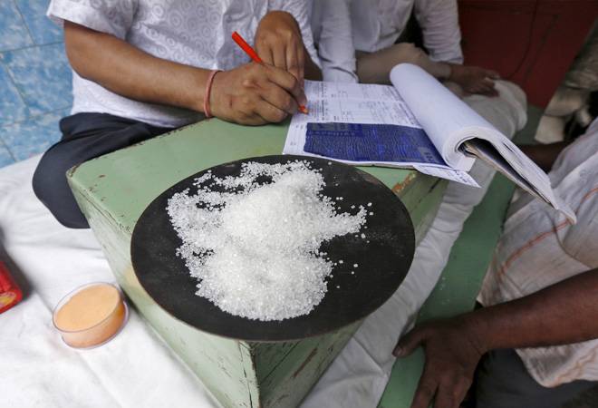 Sample of sugar at the table of a trader at a wholesale market. Image: Reuters
