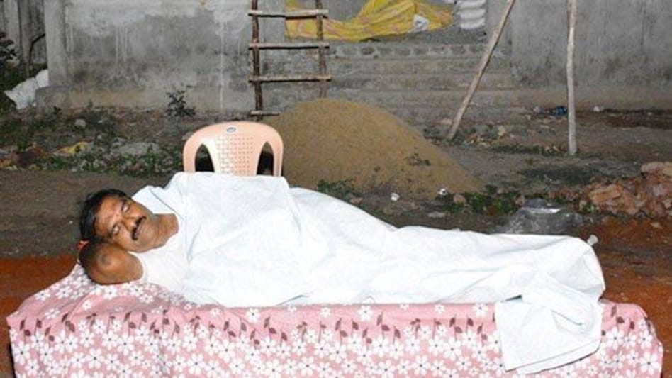 TDP MLA Nimmala Rama Naidu sleeping outside crematorium in Palakole town of West Godavari in Andhra Pradesh. TDP MLA Nimmala Rama Naidu sleeping outside crematorium in Palakole town of West Godavari in Andhra Pradesh.