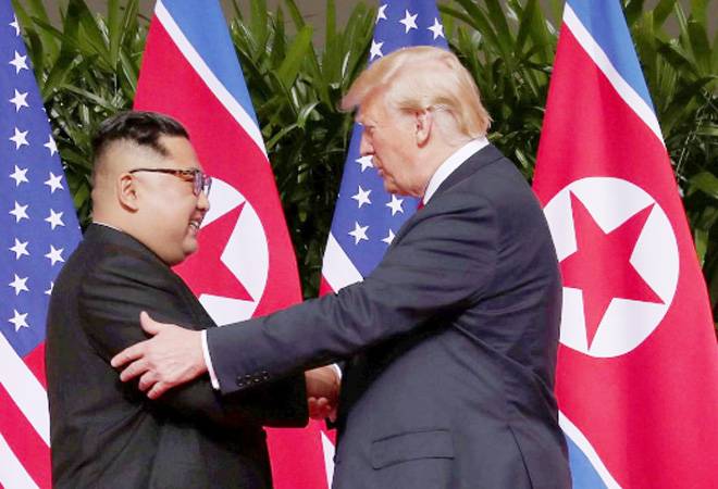 Donald Trump, Kim Jong Un shake hands to launch historic US-North Korea summit