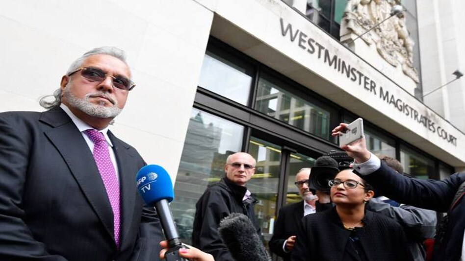 Vijay Mallya talks to reporters outside the Westminsters Magistrates' Court in London. Image: Reuters Vijay Mallya talks to reporters outside the Westminsters Magistrates' Court in London. Image: Reuters