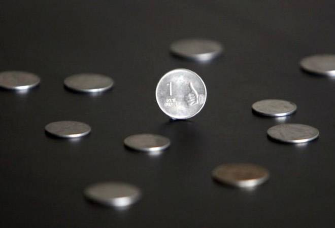 Rupee rebounds from lifetime lows on dollar sale, strong equities; hits IT stocks