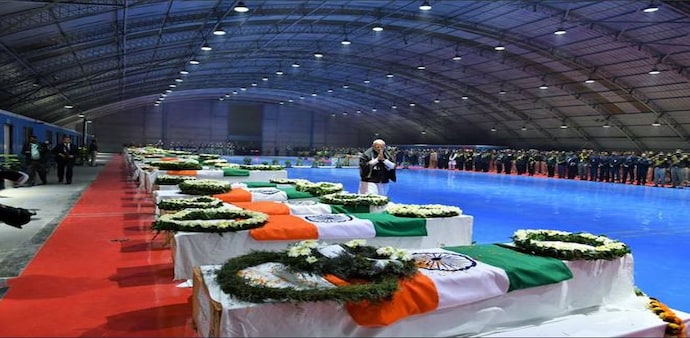 Prime Minister Narendra Modi pays last respects to the CRPF jawans, martyred in Pulwama attack, at Palam airport. Photo: PTI Prime Minister Narendra Modi pays last respects to the CRPF jawans, martyred in Pulwama attack, at Palam airport. Photo: PTI