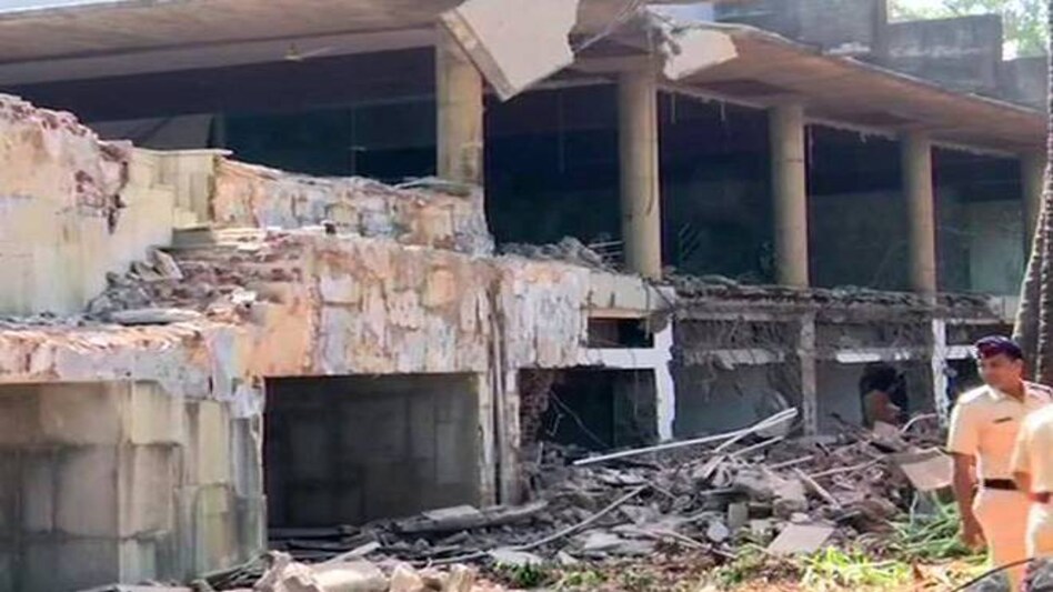 Fugitive diamantaire Nirav Modi's posh bungalow on Kihim beach in Alibaug, Maharashtra was demolished through a controlled explosion with dynamites Friday by the office of the district Collector of Raigad. Fugitive diamantaire Nirav Modi's posh bungalow on Kihim beach in Alibaug, Maharashtra was demolished through a controlled explosion with dynamites Friday by the office of the district Collector of Raigad.
