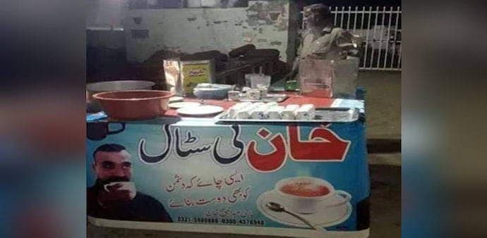 The picture on the poster is a grab from one of the videos of IAF pilot Abhinandan where he is sipping on some tea after being captured by Pakistani army and thanking one of the army officials for the tea being hot and nice. The picture on the poster is a grab from one of the videos of IAF pilot Abhinandan where he is sipping on some tea after being captured by Pakistani army and thanking one of the army officials for the tea being hot and nice.