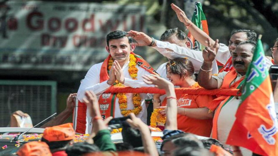 Former cricketer and BJP candidate from East Delhi Gautam Gambhir greets his supporters during an election roadshow for Lok Sabha elections, in New Delhi. (Photo: PTI) Former cricketer and BJP candidate from East Delhi Gautam Gambhir greets his supporters during an election roadshow for Lok Sabha elections, in New Delhi. (Photo: PTI)