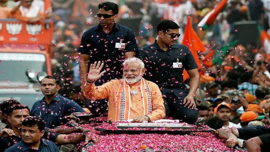 Prime Minister Narendra Modi landed in Varanasi to hold a major roadshow in the temple town of UP. Prime Minister Narendra Modi landed in Varanasi to hold a major roadshow in the temple town of UP.