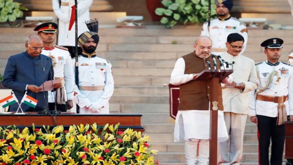Amit Shah taking oath as a Union minister in Narendra Modi's new Cabinet during a swearing-in ceremony at Rashtrapati Bhavan on May 30. Amit Shah taking oath as a Union minister in Narendra Modi's new Cabinet during a swearing-in ceremony at Rashtrapati Bhavan on May 30.