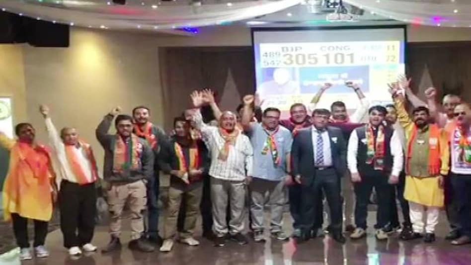 BJP supporters in Australia's Sydney and Melbourne have started celebrating as trends show the party leading BJP supporters in Australia's Sydney and Melbourne have started celebrating as trends show the party leading