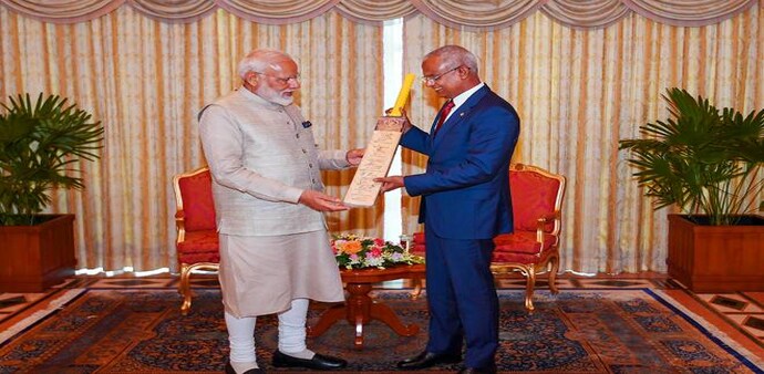 Prime Minister Narendra Modi presents a cricket bat signed by Indian World Cup team to President of Maldives Ibrahim Mohamed Solih in Maldives. PTI Prime Minister Narendra Modi presents a cricket bat signed by Indian World Cup team to President of Maldives Ibrahim Mohamed Solih in Maldives. PTI