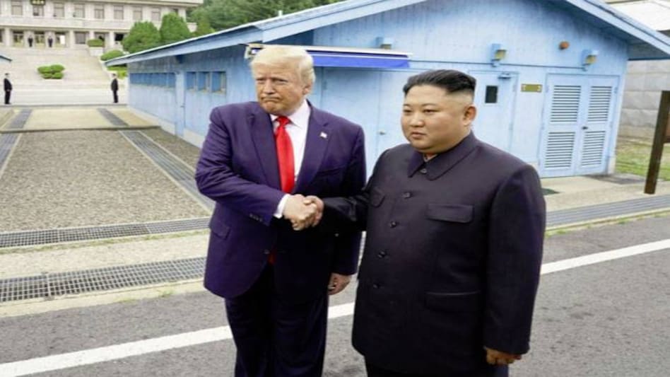 "It's a great day for the world," Trump said as he and Kim stood together amidst a throng of press photographers, aides and bodyguards. "It's a great day for the world," Trump said as he and Kim stood together amidst a throng of press photographers, aides and bodyguards.