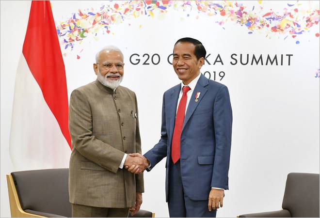 PM Narendra Modi with Indonesian President Joko Widodo at G20 Summit in Osaka. PM Narendra Modi with Indonesian President Joko Widodo at G20 Summit in Osaka.