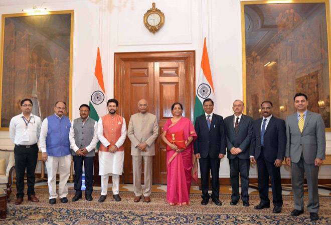 Nirmala Sitharaman with her red-cloth bag, along with President Kovind and ministers before presenting the Union Budget 2019 Nirmala Sitharaman with her red-cloth bag, along with President Kovind and ministers before presenting the Union Budget 2019