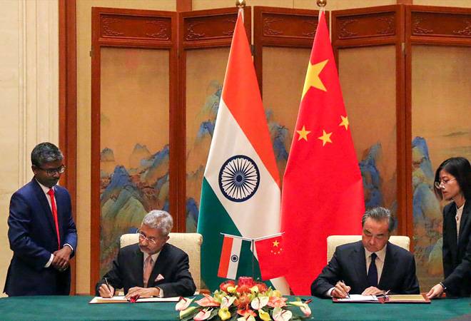 Indian External Affairs Minister S Jaishankar signs bilateral agreements with his Chinese counterpart Wang Yi. Photo credit: PTI Indian External Affairs Minister S Jaishankar signs bilateral agreements with his Chinese counterpart Wang Yi. Photo credit: PTI