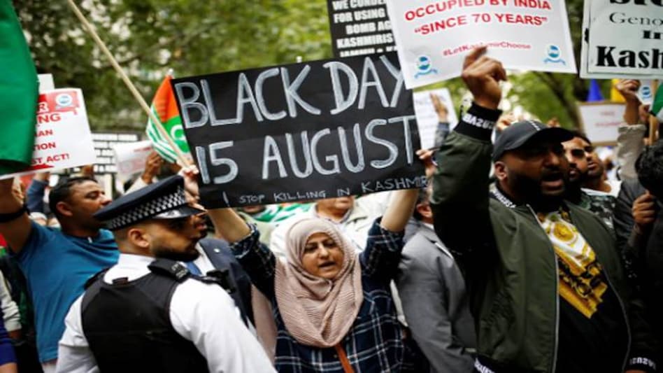 In London, protesters carried banners saying "Kashmir is Burning", "Free Kashmir" and "Modi: Make Tea Not War". Photo: Reuters In London, protesters carried banners saying "Kashmir is Burning", "Free Kashmir" and "Modi: Make Tea Not War". Photo: Reuters