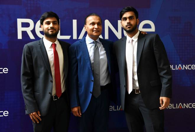 Anil Ambani along with his sons, Anmol and Anshul, at Reliance group's AGM in Mumbai on Tuesday. Anil Ambani along with his sons, Anmol and Anshul, at Reliance group's AGM in Mumbai on Tuesday.