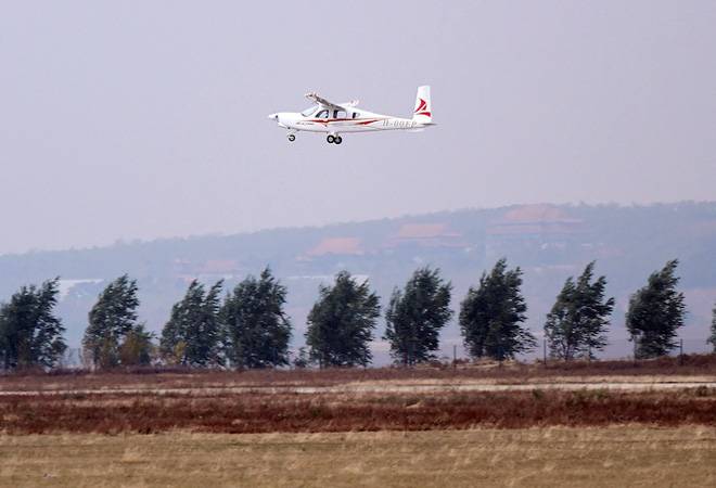 China tests first electric plane/PC: Caixin Global China tests first electric plane/PC: Caixin Global