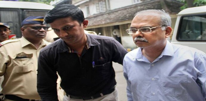 Suspended PMC Bank MD Joy Thomas (right) being produced before a court in relation to the PMC Bank scam. Photo credit: PTI Suspended PMC Bank MD Joy Thomas (right) being produced before a court in relation to the PMC Bank scam. Photo credit: PTI