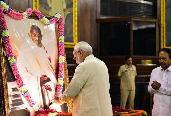 Prime Minister Narendra Modi pays tribute to Mahatma Gandhi on his 150th birth anniversary at Parliament House, in New Delhi, Wednesday. Photo: PTI Prime Minister Narendra Modi pays tribute to Mahatma Gandhi on his 150th birth anniversary at Parliament House, in New Delhi, Wednesday. Photo: PTI