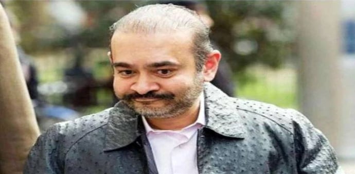 PNB Scam: Fugitive diamantaire Nirav Modi appeared before Westminster Magistrates' Court in London from his prison for a routine "call-over" hearing. PNB Scam: Fugitive diamantaire Nirav Modi appeared before Westminster Magistrates' Court in London from his prison for a routine "call-over" hearing.
